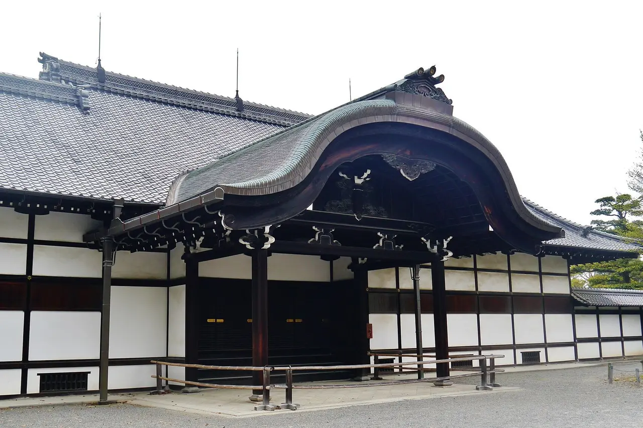 The entrance hall of the Honmaru Palace at Nijo Castle, with a curved cusped gable over the doorway and white plaster walls